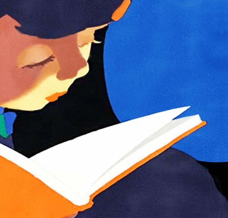 Child reading a book against dark background