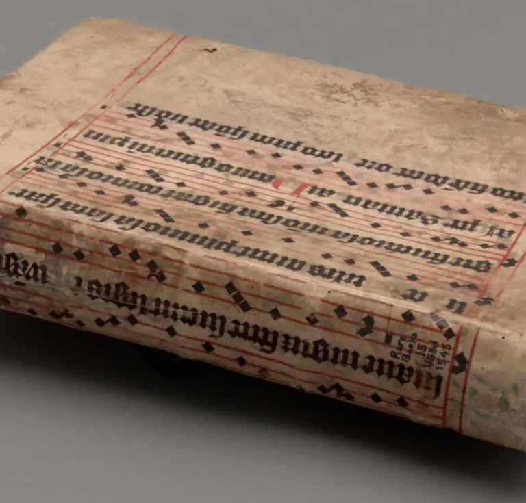 Andreas Vesalius, De humani corporis fabrica, 1543, concealed in a binding made from a medieval antiphonal leaf